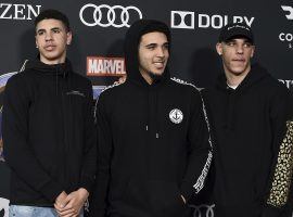 LeMelo (left), LiAngelo (center), and Lozno Ball (right) all sign with Jay-Z's sports agency, Roc Nation. (Image: Jordan Strauss/AP)