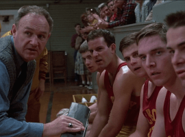 Coach Norman Dale (Gene Hackman) with his Hickory players during a timeout in 'Hoosiers' (1986). (Image: Orion Pictures)