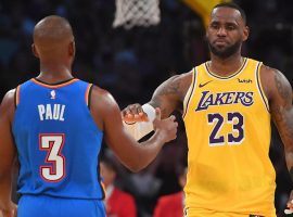 Chris Paul (left) and LeBron James (right) meet during a Nov. 2019 NBA game at the Staples Center. (Image: Jayne Kamin-Oncea/USA Today)