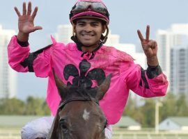 Luis Saez flashes the number of victories he had in one day earlier this year. It also equals the number of days he's suspended after serving at 15-day suspension for reckless riding during last year's Kentucky Derby. (Image: Lauren King/Gulfstream Park