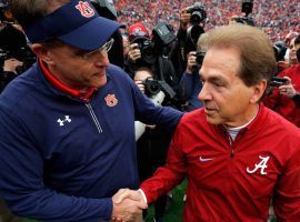 Auburn football head coach Gus Malzahn, left, and Alabamaâ€™s Nick Saban are dealing with players who have tested positive for COVID-19. (Image: Getty)