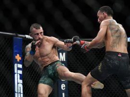 Max Holloway (right) comes in as a modest underdog at UFC 251 in his rematch against Alexander Volkanovski (left). (Image: Stephen R. Sylvanie/USA Today Sports)