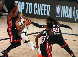 Milwaukee Bucks big man Giannis Antetokounmpo drives through Miami Heat traffic in the paint. (Image: Kim Klement/USA Today Sports)