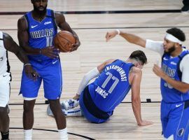 Dallas Mavericks guard Luka Doncic twists his ankle in Game 3 against the LA Clippers in Orlando, FL. (Image: Ashley Landis/AP)