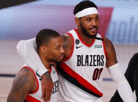 Damian Lillard and Carmelo Anthony celebrate a victory for the Portland Trail Blazers in Orlando, FL. (Image: Kevin C. Cox/Getty)