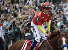 Mike Smith and his fellow jockeys aren't smiling about Churchill Downs' mandate they give up two weeks of rides to ride in the Kentucky Derby or Kentucky Oaks. (Image: Julio Cortez/Associated Press)