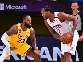 LeBron James of the LA Lakers guards Kawhi Leonard from the LA Clippers in Orlando, FL. (Image: Getty)