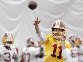 Washington quarterback Alex Smith has returned to the football field 22 months after a leg injury that nearly cost him his life. (Image: Getty)