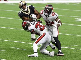 It takes multiple Tampa Bay Bucs and an ankle injury to tackle Michael Thomas of the New Orleans Saints. (Image: Chris Graythen/Getty)