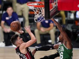 Miami Heat rookie Tyler Herro drives to the basket against Marcus Smart of the Boston Celtics in Game 4. (Image: Mark J. Terrill/AP)