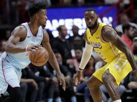 Jimmy Butler of the Miami Heat defended by LeBron James of the LA Lakers. (Image: Lynee Sladky/AP)