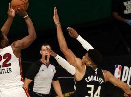 The Miami Heatâ€™s Jimmy Butler takes a shot as time expires over Giannis 'Greek Freak' Antetokounmpo of the Milwaukee Bucks in game 2. (Image: AP)