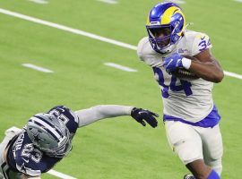 LA Rams RB Malcolm Brown evades tacklers against the Dallas Cowboys at SoFi Stadium in LA. (Image: Getty)