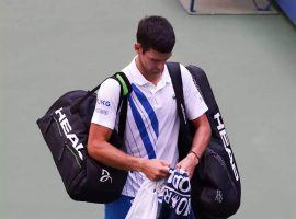 Novak Djokovic received a default in his fourth-round US Open match against Pablo Carreno Busta after accidentally striking a line judge with a ball he hit out of anger. (Image: AFP)