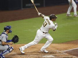 Manny Machado of the San Diego Padres hits a home run against the LA Dodgers. (Image: KC Alfred//Getty)