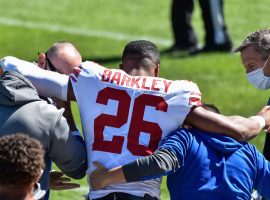 Medical staff help Saquon Barkley off the field after his knee injury against the Chicago Bears in Week 2. (Image: Jeffrey Becker/USA Today Sports)