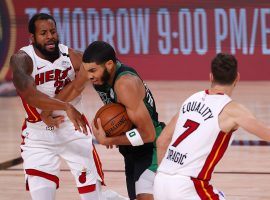 Boston Celtics forward Jayson Tatum drives by Andre Iguodala and Goran Dragic of the Miami Heat. (Image: Mike Ehrmann/Getty)