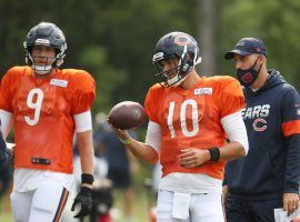 Mitchell Trubisky, right, was named the Chicago Bears starting quarterback over Nick Foles, while Cam Newton won the job in New England.