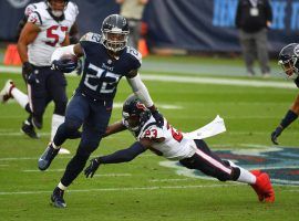 Tennessee Titans RB Derrick Henry evades tacklers against the Houston Texans. (Image: Christopher Hanewinckel/USA Today Sports)