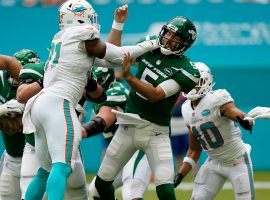 Miami Dolphins DE Emmanuel Ogbah pressures QB Joe Flacco of the New York Jets in their shutout loss. (Image: Lynn Sladky/AP)