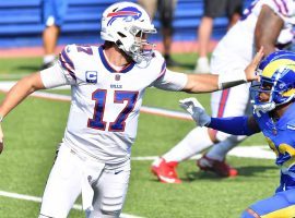 Buffalo Bills QB Josh Allen stiff arms Troy Hill of the LA Rams. (Image: Mark Konezny/USA Today Sports)