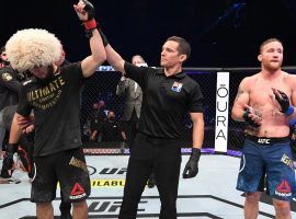 Khabib Nurmagomedov (left) announced his retirement after defeating Justin Gaethje (right) in the main event of UFC 254 on Saturday. (Image: Josh Hedges/Zuffa/Getty)