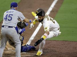 San Diego Padres star Fernando Tatis, Jr dives into home plate against the LA Dodgers. (Image: Gregory Bull/AP)