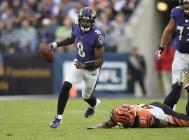 Baltimore Ravens QB Lamar Jackson eludes the Cincy Bengals defense, but he could not fade COVID-19. (Image: Nick Wass/AP)