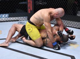 Glover Teixeira (top) submitted Thiago Santos (bottom) to establish himself as the top contender in the UFC light heavyweight division. (Image: Jeff Bottari/Zuffa/Getty)