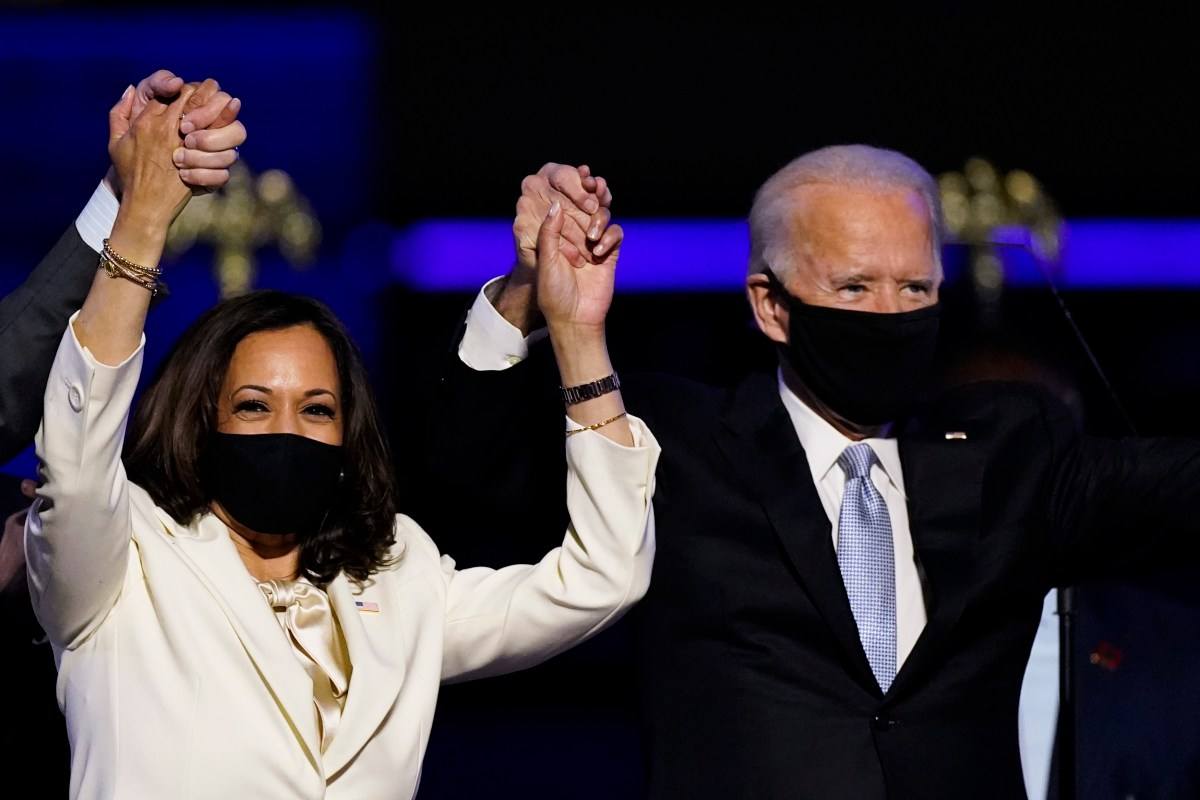 President-elect Joe Biden and vice president-elect Kamala Harris raise their hands in victory on Nov. 7. Some leading sportsbooks have yet to pay on the Biden win. (Image: AP)