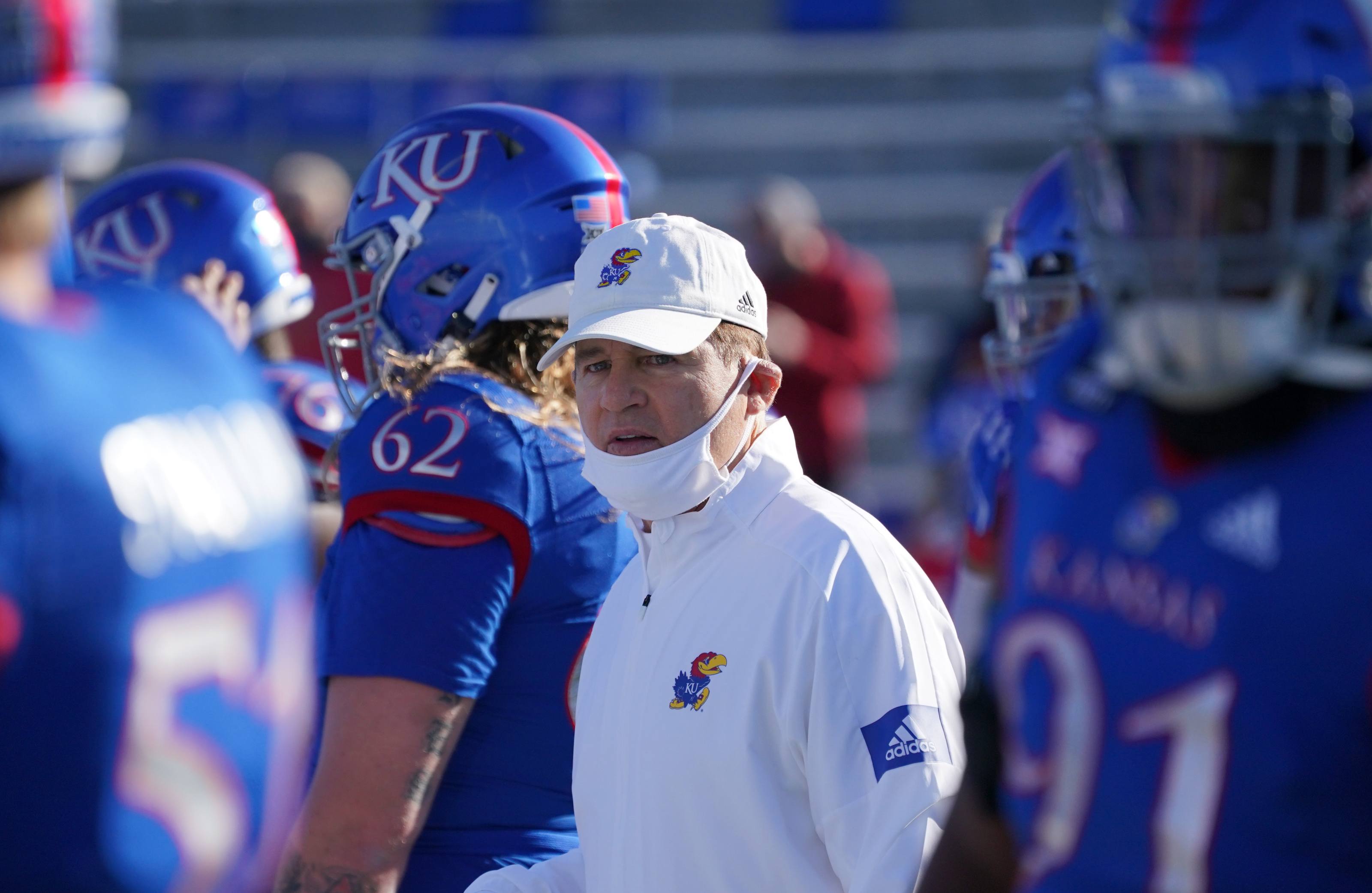 Kansas coach Les Miles wearing mask