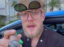 Jake Paul called out Conor McGregor in a video while wearing the Irish flag, smoking a cigar, and drinking whisky. (Image: Jake Paul/Instagram)