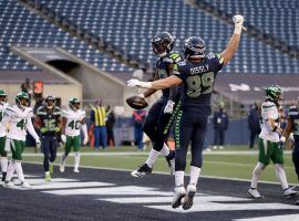 David Moore and Will Dissley of the Seattle Seahawks celebrate a touchdown in a blowout over the New York Jets. (Image: Abbie Parr/Getty)