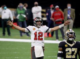 Tom Brady celebrates a touchdown for the Tampa Bay Bucs over the New Orleans Saints in the NFC divisional playoffs. Brady and the Bucs are one win away from the Super Bowl. (Image: Chris Graythen/Getty)