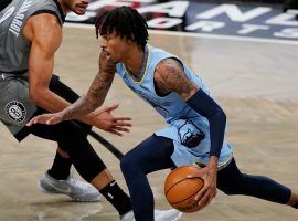 Memphis Grizzlies point guard Ja Morant blows by defenders at Barclayâ€™s Arena in Brooklyn. (Image: Kathy Willens/AP)