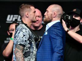Conor McGregor (right) is favored over Dustin Poirier (left) for their rematch in the main event of UFC 257. (Image: Getty)