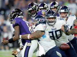 Baltimore Ravens QB Lamar Jackson seen here being gang-tackled by the Tennessee Titans defense in last seasonâ€™s AFC Wild Card. The Titans and Ravens have a rematch this year in the playoffs. Â (Image: Todd Olszewski/Getty)