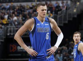 Dallas Mavericks center Kristaps Porzingis awaits a free throw. The Unicorn makes his season debut after a missing the first couple weeks recovering from surgery. (Image: Cato Cataldo/Getty)