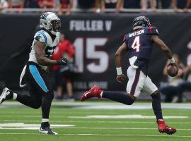 A Carolina Panthers defender pursues quarterback DeShaun Watson of the Houston Texans. (Image: Bob Levey/Getty)