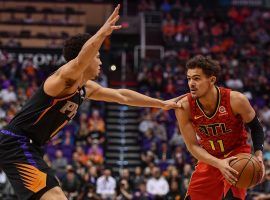 Devin Booker of the Phoenix Suns guards Trae Young from the Atlanta Hawks in a game last season, but both guards were snubs at the 2021 NBA All-Star Game. Â (Image: Jen Stewart/USA Today Sports)