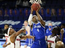 Drake forward ShanQuan Hemphill drives for a layup during a victory against Illinois State to keep their winning streak alive at 17-0. (Image: Charlie Neibergall/AP)