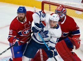 Betting on single games, like this NHL grudge match between the Toronto Maple Leafs and Montreal Canadiens, could finally be legal for Canadians. Two bills permitting legal sports wagering on single games are winding their way through Canada's government. (Image: Paul Chiasson/Canadian Press)