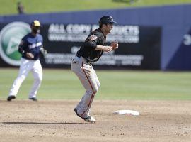 Major League Baseball wonâ€™t carry over its entire modified 2020 ruleset this year, but extra innings will still start with a runner on second base. (Image: Carlos Osorio/AP)