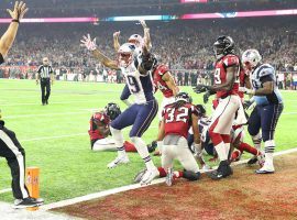 The New England Patriots celebrate after scoring a touchdown in overtime to defeat the Atlanta Falcons in Super Bowl LI. (Image: Getty)