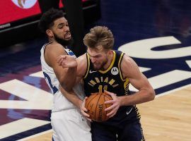 Karl-Anthony Towns of the Minnesota Timberwolves defends Indiana Pacers forward Domantas Sabonis. Sabonis recorded his third triple-double of the season. (Image: Brad Rempel/USA Today Sports)