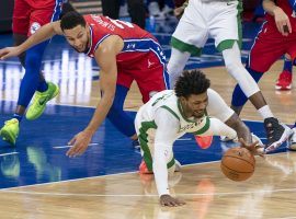 Boston Celtics guard Marcus Smart, seen here diving for a loose ball against point guard Ben Simmons from the Philadelphia 76ers. The Sixers are now co-favorites to win the Atlantic Division. (Image: Chris Szagola)