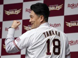 Ex-Yankees starter Masahiro Tanaka shows off his new jersey after he signed a contract with the Tohoku Rakuten Golden Eagles. (Image: Eugene Hoshiko/AP)