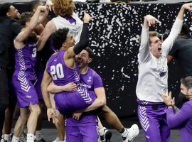 Members of #14 Abilene Christian celebrate their upset victory over #3 Texas in the first round of 2021 March Madness (Image: Getty)