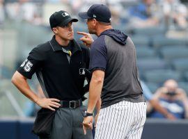 New York Yankees manager Aaron Boones rants at home plate umpire Brennan Miller after he ejected Boone in a game against the Tampa Bay Rays in July 2019. (Image: Kathy Willens/AP)