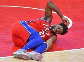 Philadelphia 76ers center Joel Embiid moments after his leg buckled after a dunk against the Washington Wizards at the Wells Fargo Center. (Image: Brad Mills/USA Today Sports)